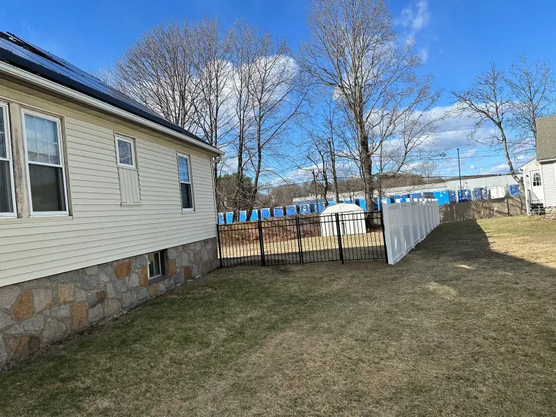 Custom iron driveway gate installed in Quincy, Massachusetts